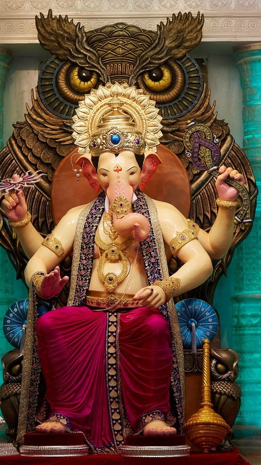 Majestic Ganesha Statue with Owl Backdrop and Golden Jewelry HD phone wallpaper