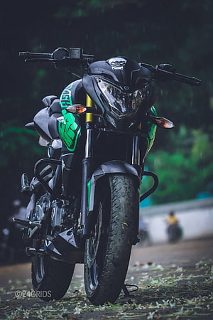 Black and Green Kawasaki Ninja Motorcycle Parked on Wet Street HD phone wallpaper