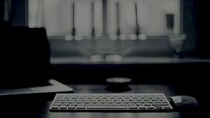 Minimalist Dark Workspace Setup with Keyboard and Mouse HD wallpaper