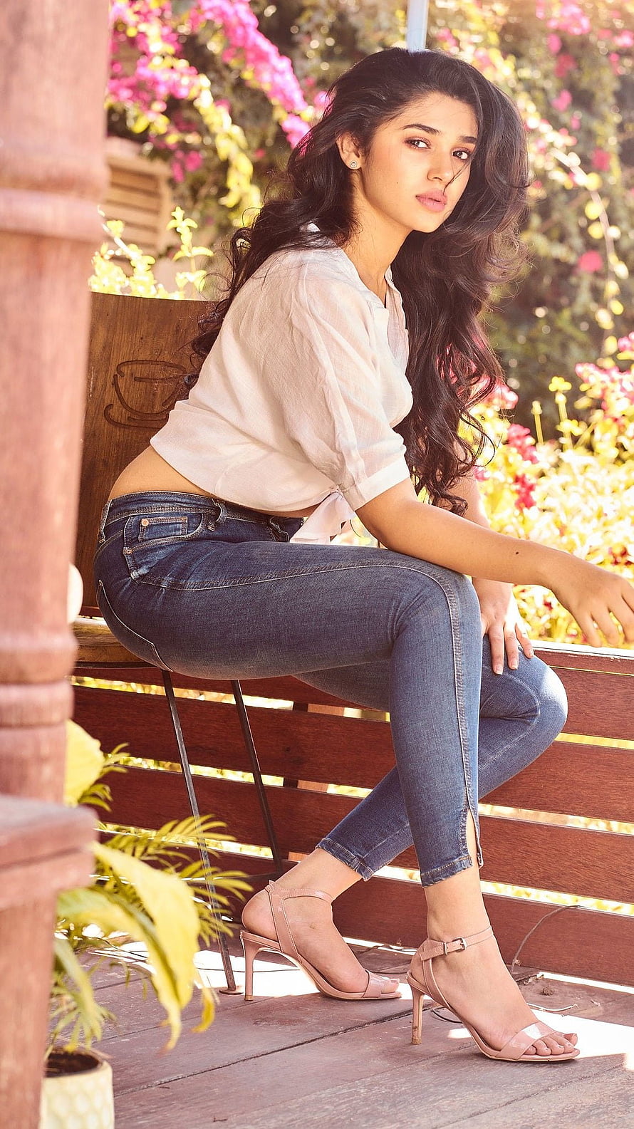 Woman in White Top and Jeans Sitting on Wooden Bench Outdoors, Kriti shetty, krithi shetty, telugu actress HD phone wallpaper