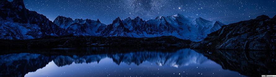 Starry Night Sky Over Snowy Mountain Range Reflected in Calm Lake HD wallpaper