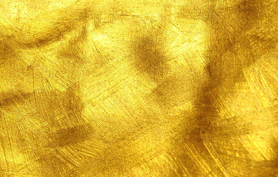 Luxurious Gold Leaf Texture with Brushed Metallic Finish and Warm Amber Tones HD wallpaper