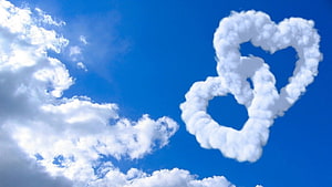 Heart-Shaped Cloud Formation Against a Vivid Blue Sky HD wallpaper
