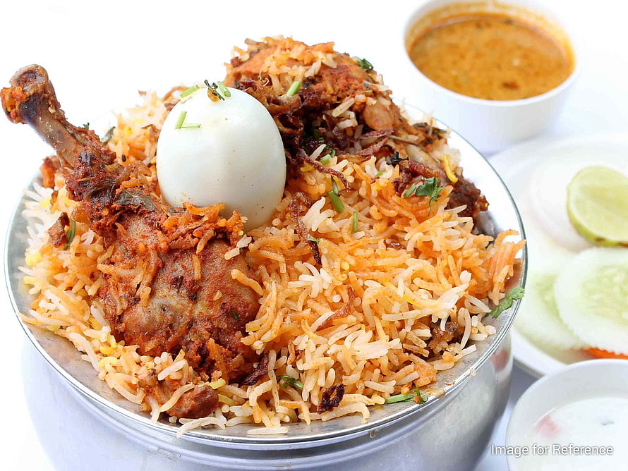 Delicious Chicken Biryani with Hard-Boiled Egg and Raita Served in a Steel Bowl HD wallpaper