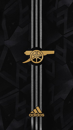 Arsenal FC and Adidas collaboration wallpaper featuring the golden cannon logo on a black textured background with silver stripes HD phone wallpaper