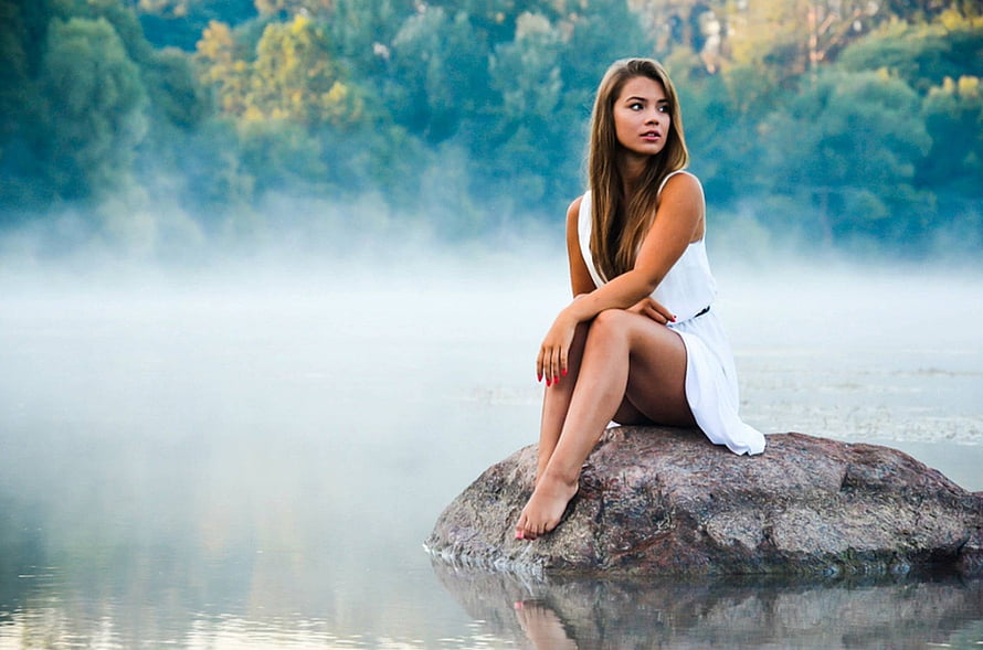 Beautiful Woman in White Dress Sitting on Rock in Misty Lake, Brunette, girl, model, people, woman HD wallpaper