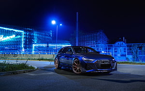 Audi RS 6 Avant C8 Night Exterior with Blue Industrial Backdrop HD wallpaper