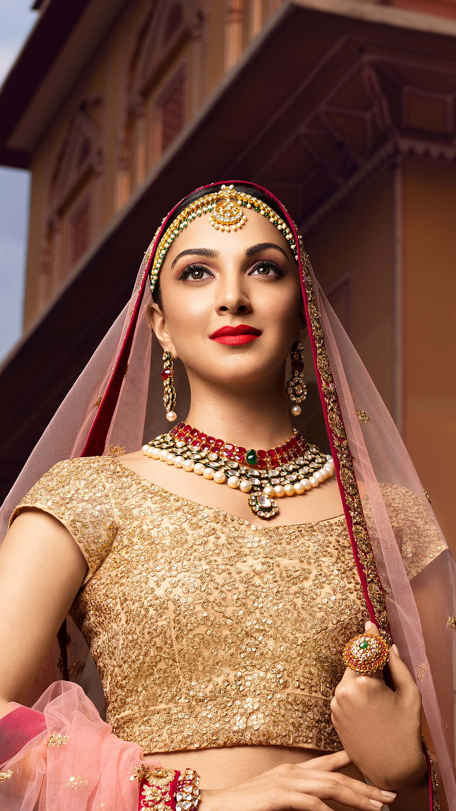 Kiara Advani in Traditional Indian Bridal Attire with Gold Jewelry and Pink Veil HD phone wallpaper