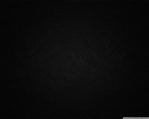 Dark Black Leather Texture Background with Subtle Grain and Minimalist Surface Detail HD wallpaper