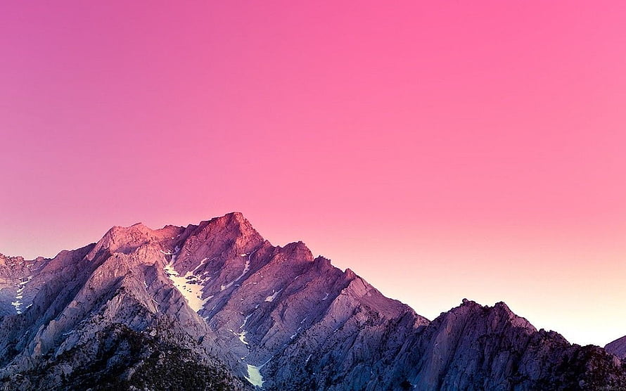 Majestic Mountain Peaks Under a Vibrant Pink Sunset Sky HD wallpaper