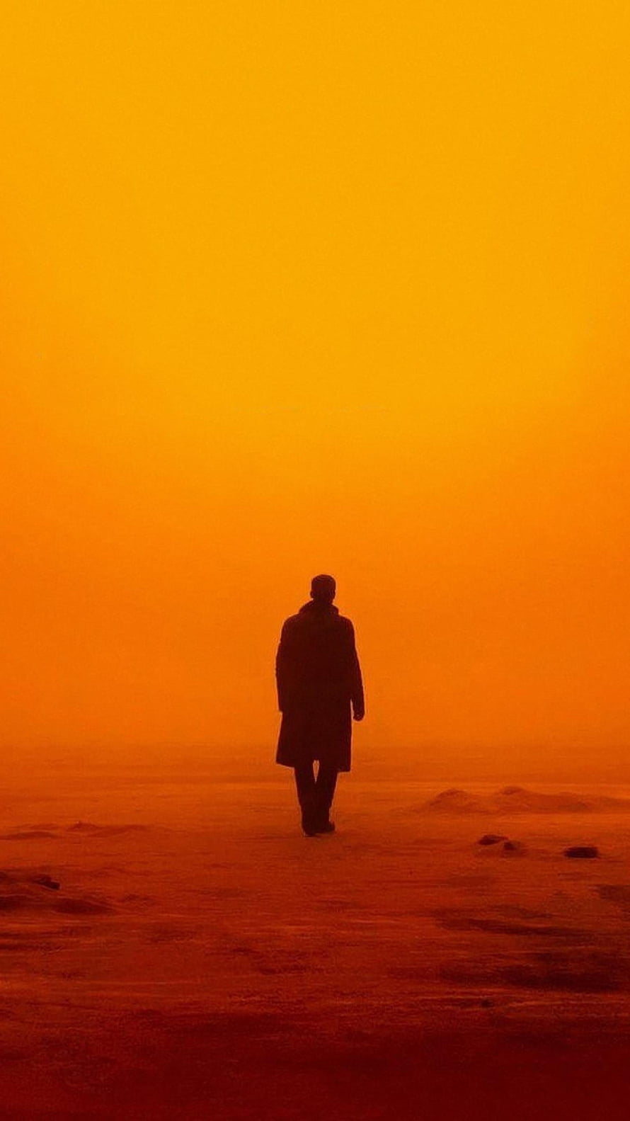 Silhouette of a man walking alone in a vast orange desert landscape at sunset, Blade Runner 2049 (2022) movie HD phone wallpaper