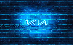 Kia Neon Logo Glowing on Wet Blue Brick Wall at Night HD wallpaper