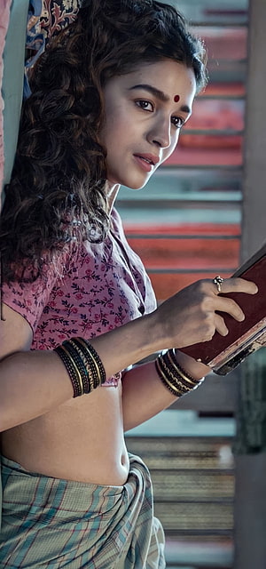 Alia Bhatt in traditional Indian attire with floral blouse and bangles holding a book HD phone wallpaper