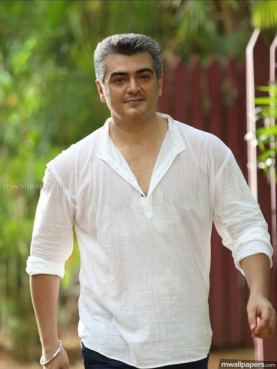 Arbaaz Khan in a white shirt walking outdoors with a confident smile HD phone wallpaper
