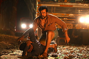 Intense Nighttime Fight Scene from Kaithi Movie with Truck Backdrop HD wallpaper