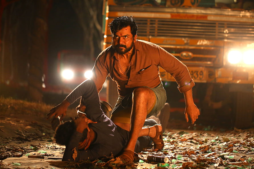 Intense Nighttime Fight Scene from Kaithi Movie with Truck Backdrop HD wallpaper