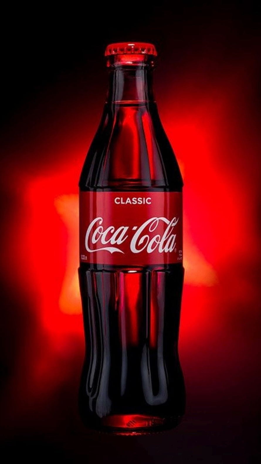 Classic Coca-Cola Glass Bottle with Dramatic Red Backlighting and Dark Background HD phone wallpaper