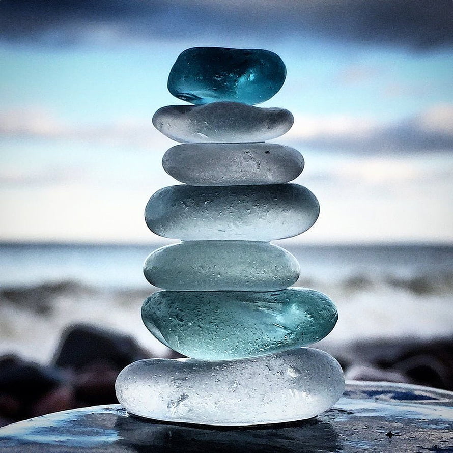 Stacked Sea Glass Stones on Beach Background HD phone wallpaper