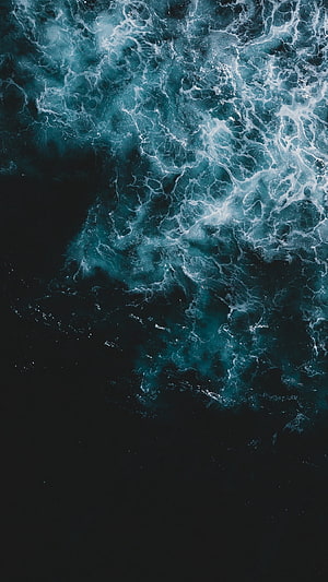 Aerial View of Dark Turquoise Ocean Waves with White Foam Swirls HD phone wallpaper