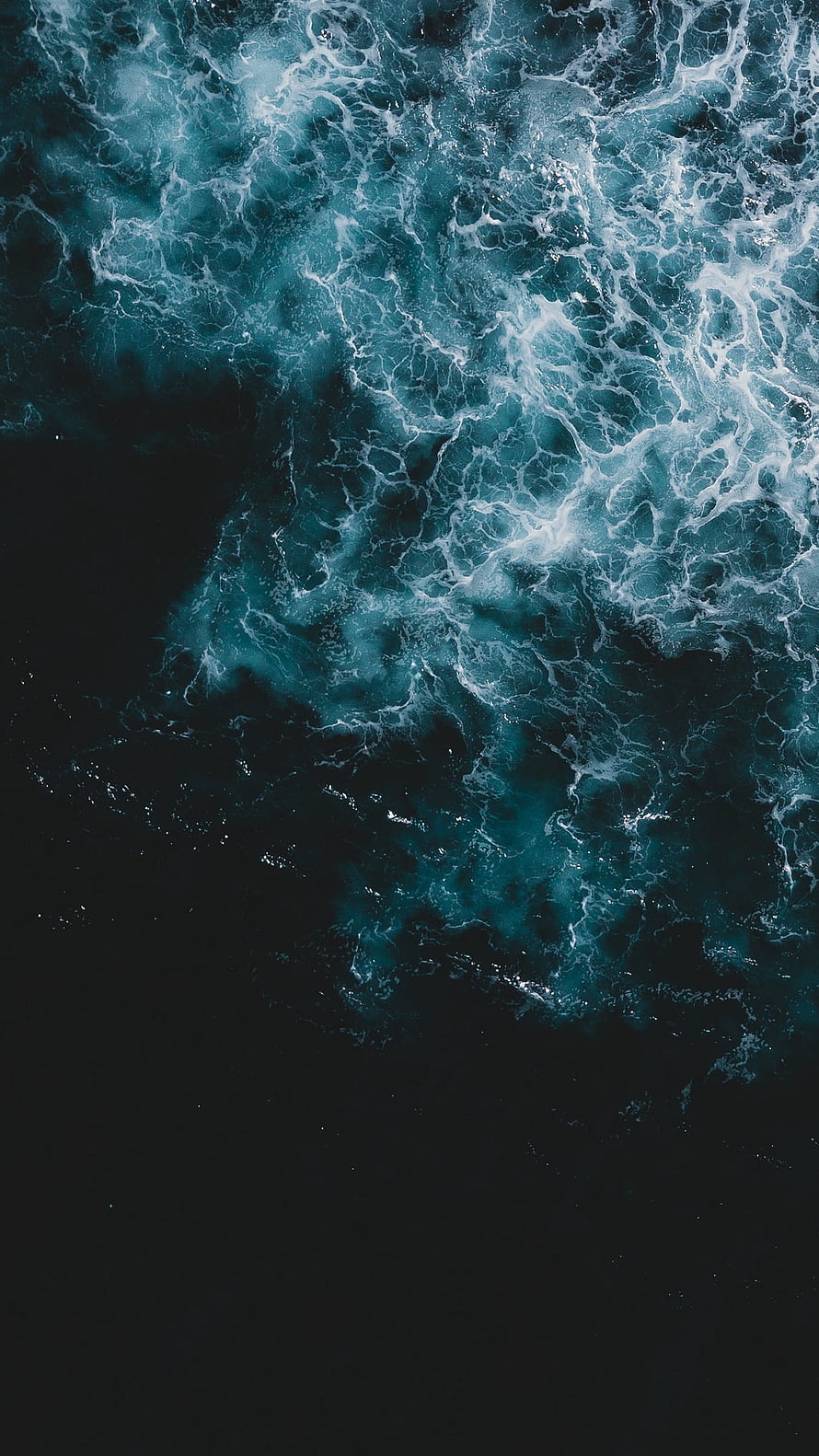 Aerial View of Dark Turquoise Ocean Waves with White Foam Swirls HD phone wallpaper