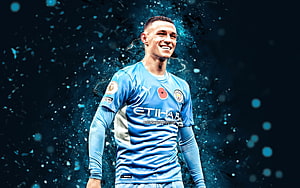 Phil Foden in Manchester City Sky Blue Kit with Dynamic Particle Effects HD wallpaper