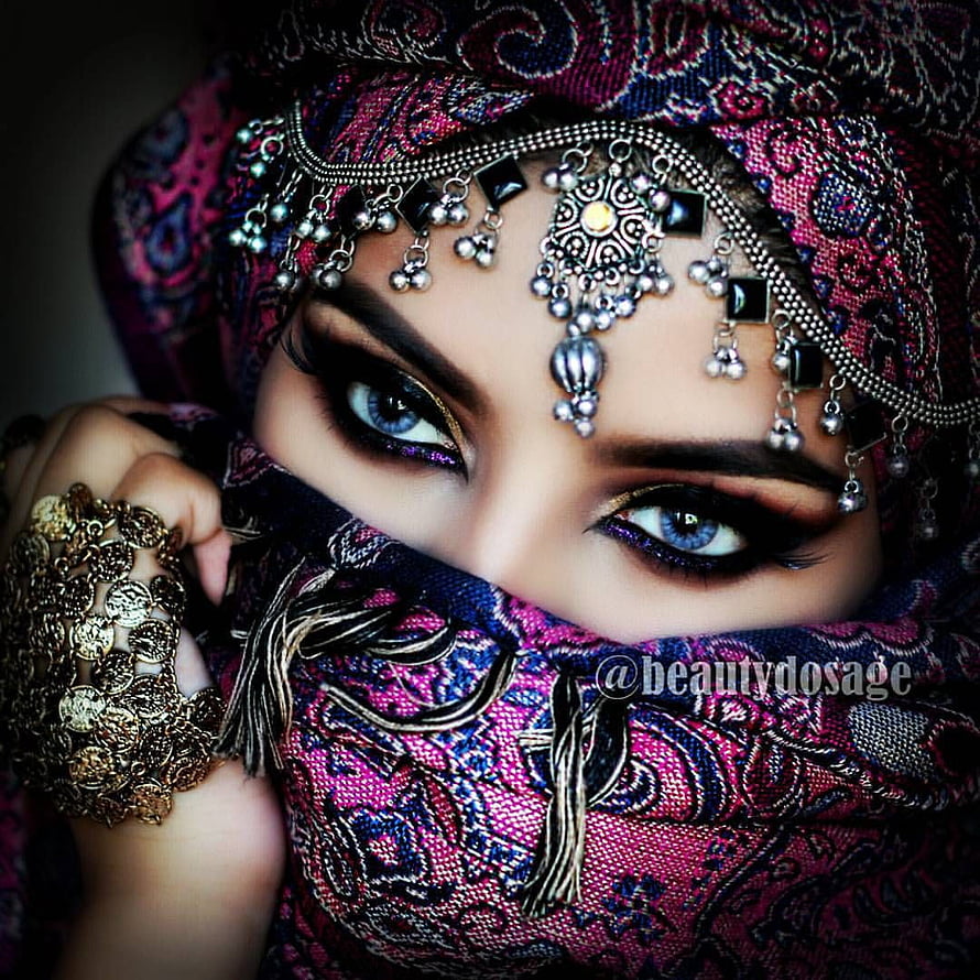 Portrait of a woman wearing a colorful patterned hijab with intricate silver jewelry and striking blue eyes, Beautiful Muslim Girls DP for WhatsApp, Beautiful Islamic Girls HD phone wallpaper