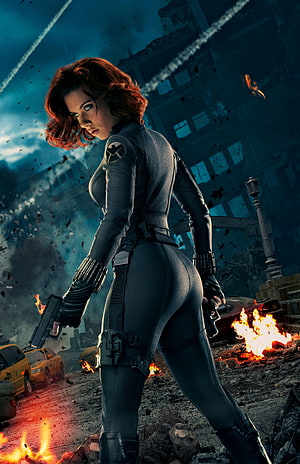 Black Widow in tactical suit holding dual pistols amid a burning cityscape from Avengers Age of Ultron HD phone wallpaper