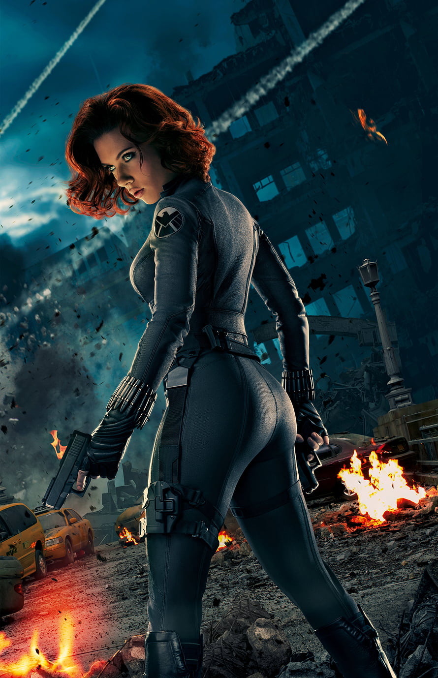 Black Widow in tactical suit holding dual pistols amid a burning cityscape from Avengers Age of Ultron HD phone wallpaper