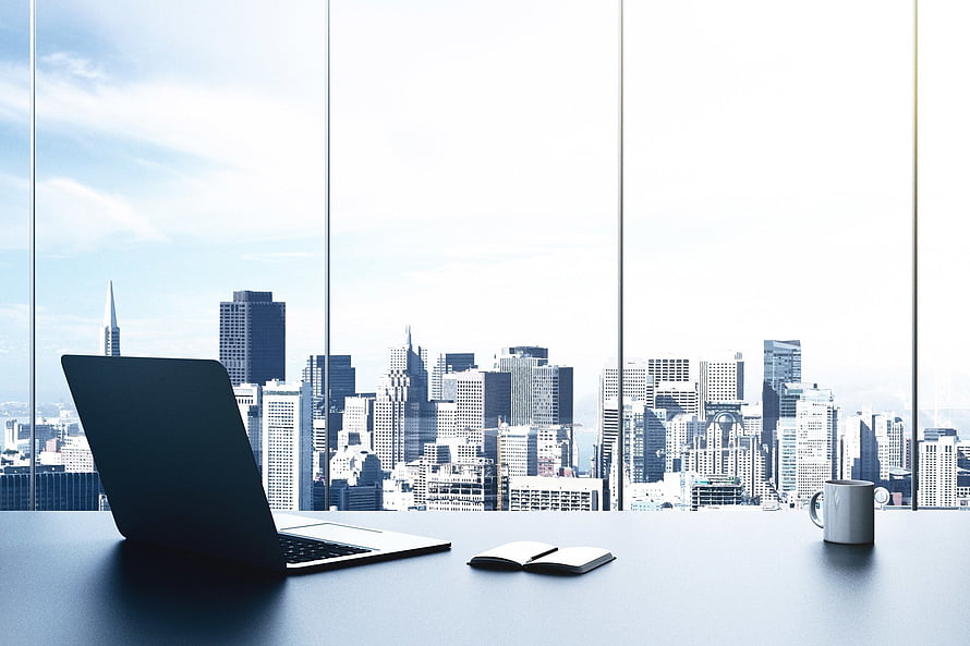 Modern Office Desk With Laptop And Coffee Overlooking City Skyline HD wallpaper