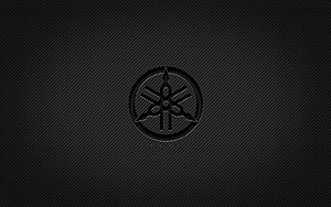 Yamaha Tuned Three Tuning Forks Logo on Dark Carbon Fiber Texture Background HD wallpaper