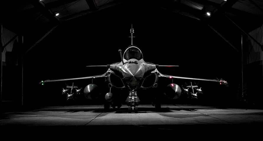 Dassault Rafale Fighter Jet Front View in Dark Hangar with Dramatic Lighting HD wallpaper