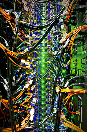 Dense Server Rack Interior With Colorful Cables And Glowing Green LEDs HD phone wallpaper