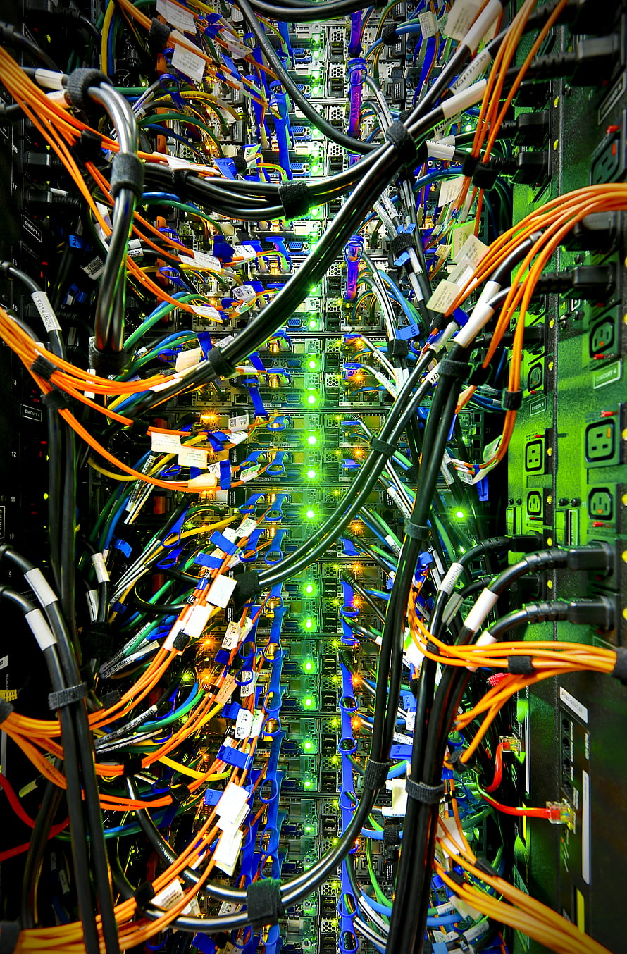 Dense Server Rack Interior With Colorful Cables And Glowing Green LEDs HD phone wallpaper