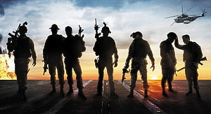 Silhouetted Special Forces Soldiers on Airfield at Sunset with Helicopter HD wallpaper