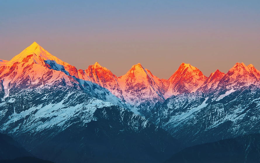 Golden Sunrise Illuminating Snow-Capped Mountain Peaks at Dawn HD wallpaper