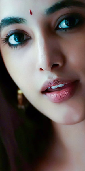 Close-up portrait of a woman with striking blue eyes and a red bindi on her forehead, Priyanka arul Mohan, Priya, Priyanka_Arul_Mohan HD phone wallpaper