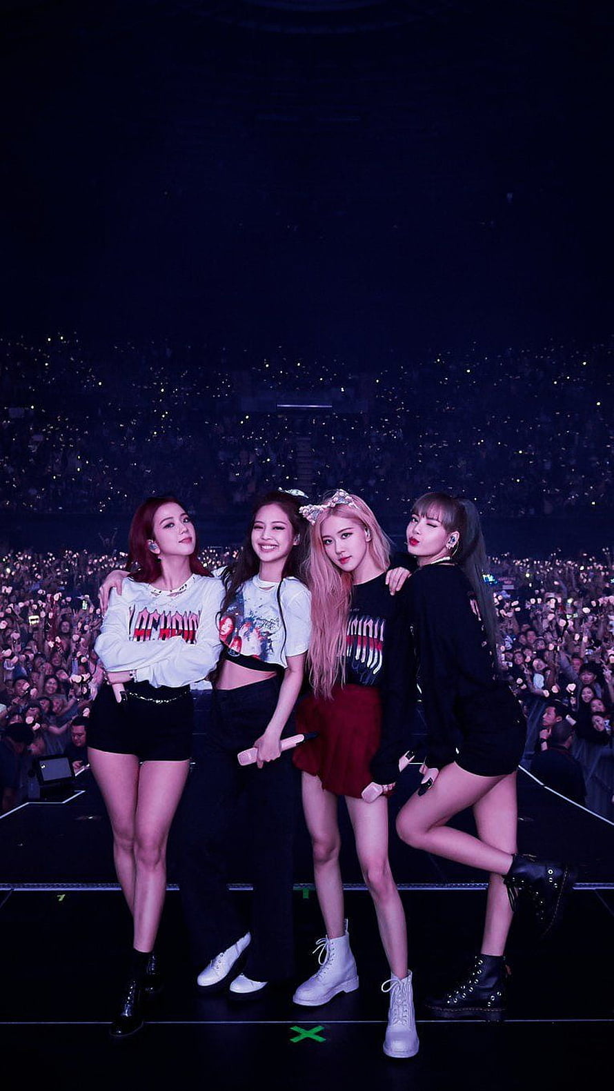 Blackpink concert stage photo with Jennie, Lisa, Rosé, and Jisoo posing together in front of a massive crowd with lightsticks HD phone wallpaper