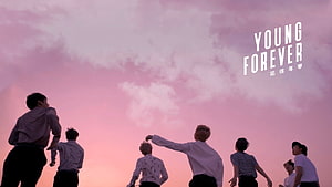 BTS Young Forever promotional artwork featuring group silhouette against pink sunset sky HD wallpaper