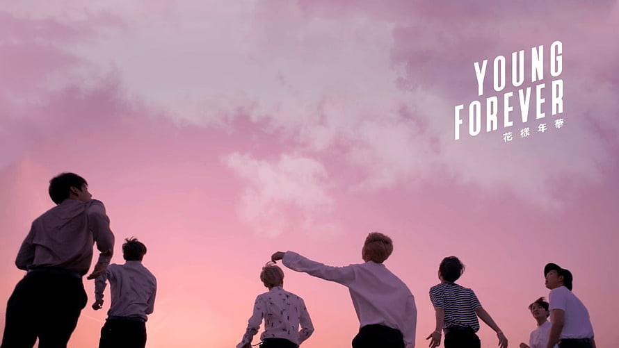 BTS Young Forever promotional artwork featuring group silhouette against pink sunset sky HD wallpaper