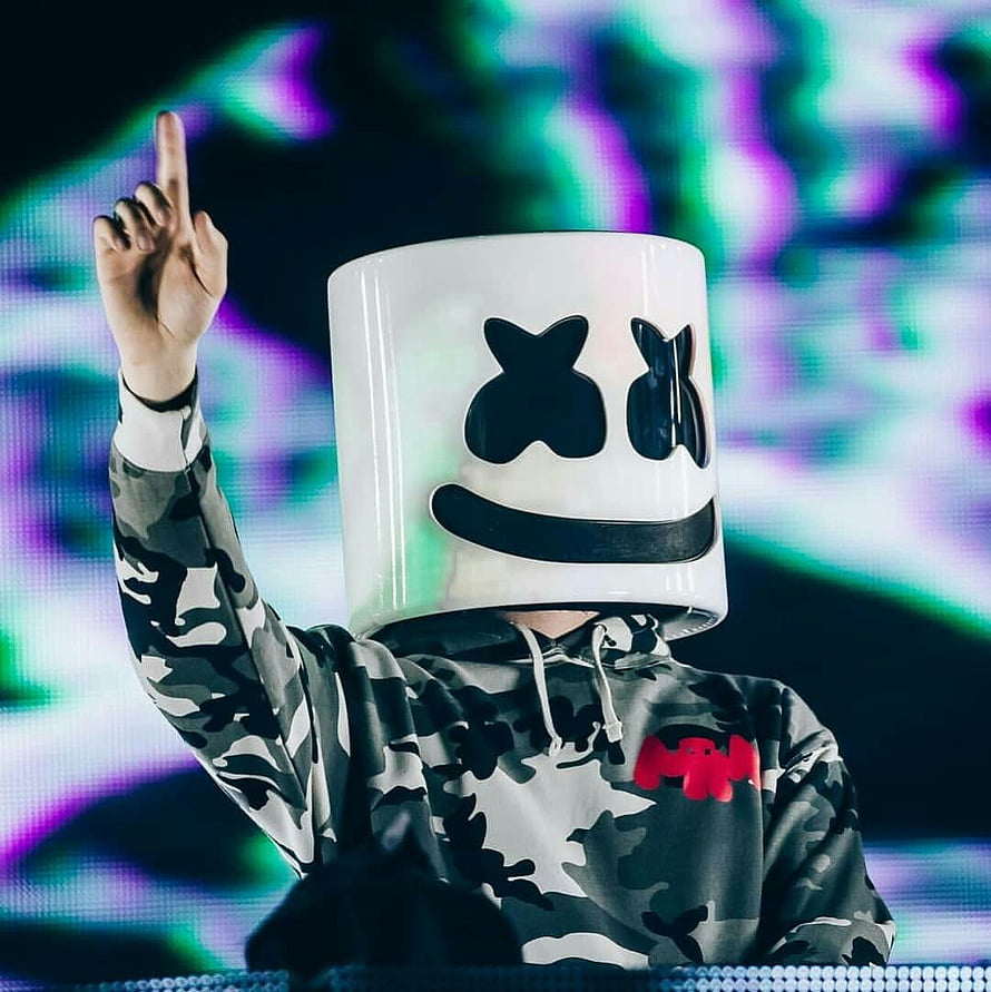 Marshmello performing on stage in a white helmet and camouflage hoodie HD phone wallpaper