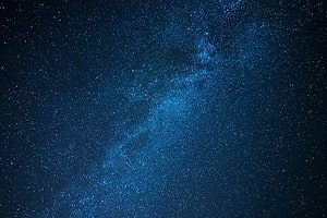 Milky Way Galaxy Spanning a Deep Blue Starry Night Sky HD wallpaper