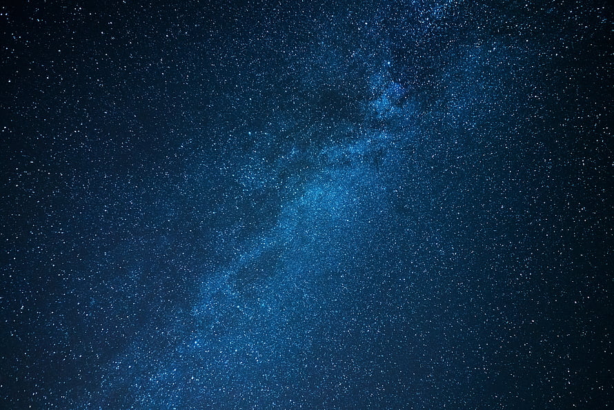 Milky Way Galaxy Spanning a Deep Blue Starry Night Sky HD wallpaper