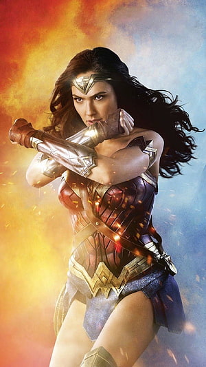 Gal Gadot as Wonder Woman in a dynamic combat stance with fiery embers and golden armor, Wonder Woman Movie - Best . Wonder woman movie, Wonder woman cosplay, Gal gadot wonder woman, Wonder Women HD phone wallpaper