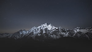 Snowy Mountain Range Under Starry Night Sky HD wallpaper