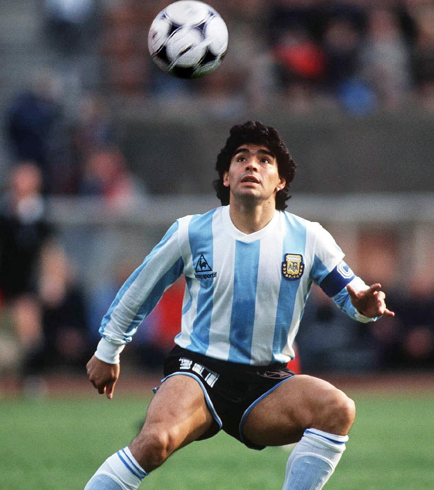 Diego Maradona in Argentina National Team Kit Controlling a Soccer Ball on the Pitch HD phone wallpaper