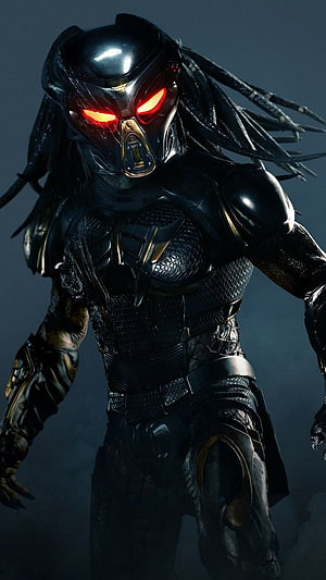 Predator Character in Black Armor with Glowing Red Eyes and Dreadlocks HD phone wallpaper