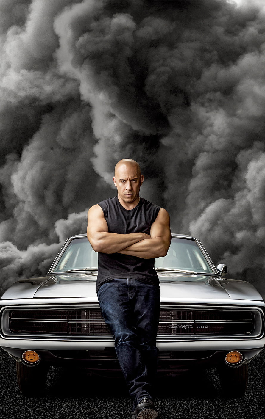 Vin Diesel as Dominic Toretto leaning on a Dodge Charger with smoke background HD phone wallpaper