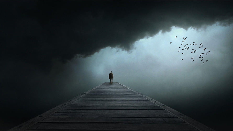 Solitary Figure Walking on a Pier Into Dark Stormy Fog with Flying Birds HD wallpaper