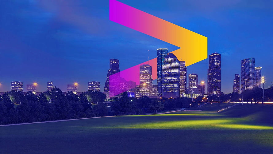 Dallas skyline at night with a large colorful gradient arrow overlay on a grassy park foreground HD wallpaper
