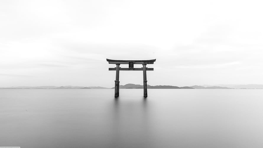 Serene Black And White Photograph Of A Traditional Japanese Torii Gate Standing In Calm Water HD wallpaper